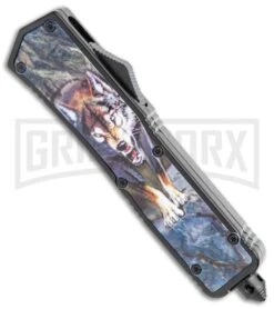Rumble Black D/A OTF Automatic Knife Dagger Wolf Graphic - Two Tone Plain Serr -Kershaw Shop Rumble Black DA OTF Auto Dagger Wolf Graphic TT Plain Serr GX 36384 jr spine large